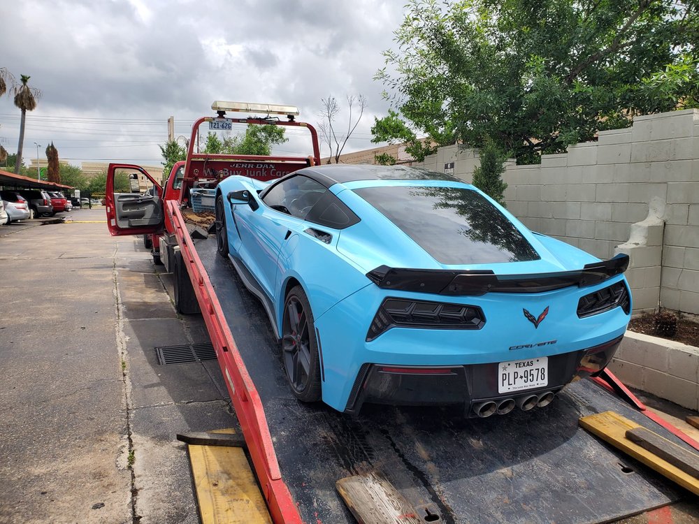 Blue Corvette on a flatbed tow truck - AA Affordable Towing