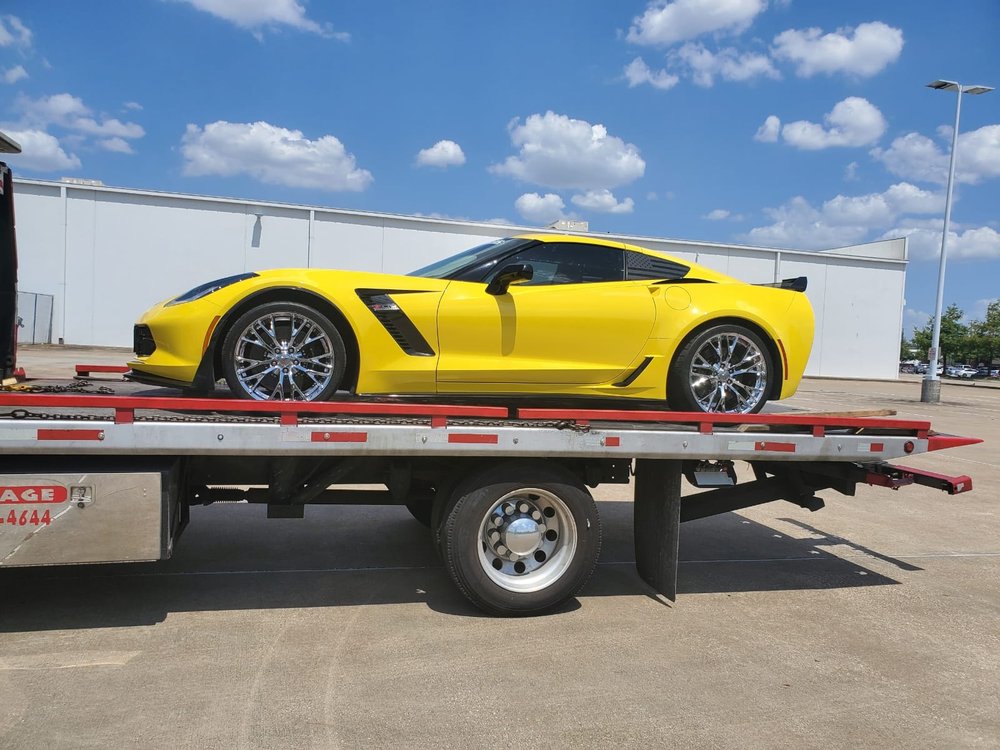 Yellow sports car transported on a flatbed - AA Affordable Towing