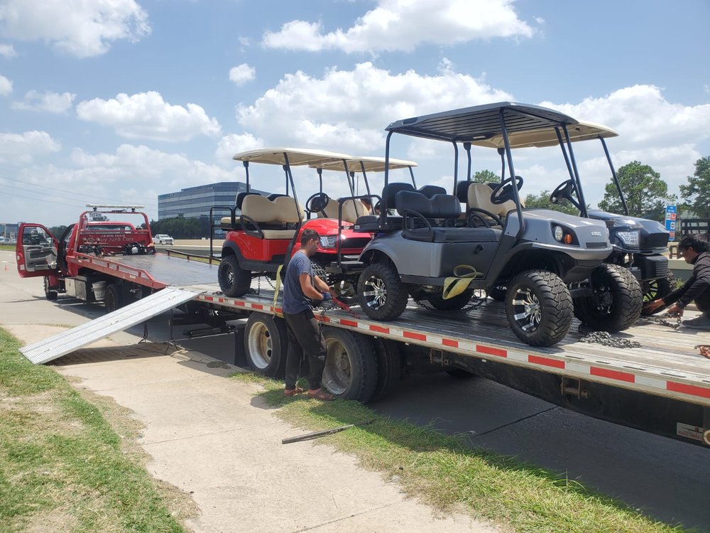 Golf carts loaded for flatbed transport - AA Affordable Towing